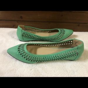 Ollie Green flats with cut out design pattern